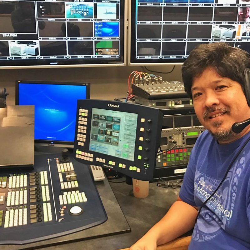 Ken Sato in television station control booth